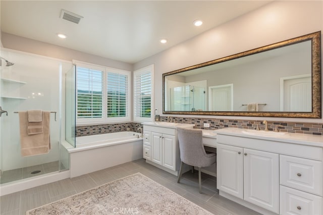 bathroom with vanity, visible vents, recessed lighting, a shower stall, and a garden tub
