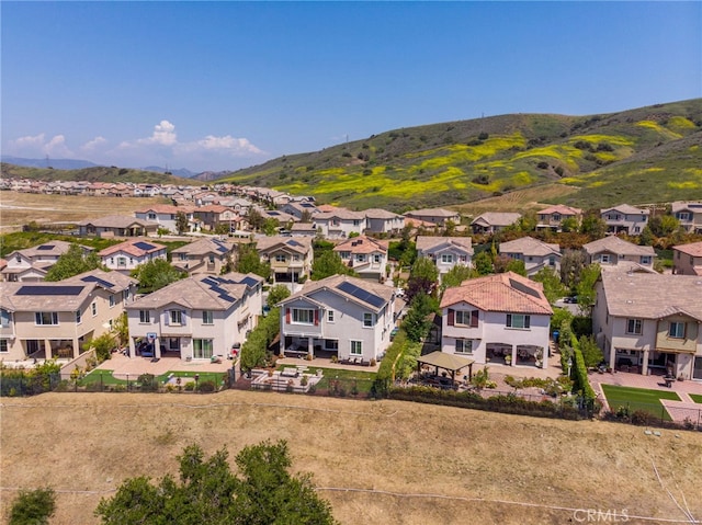 drone / aerial view with a residential view and a mountain view