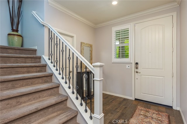 entrance foyer featuring ornamental molding, stairs, wood finished floors, baseboards, and recessed lighting