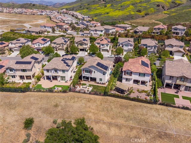 drone / aerial view with a mountain view and a residential view