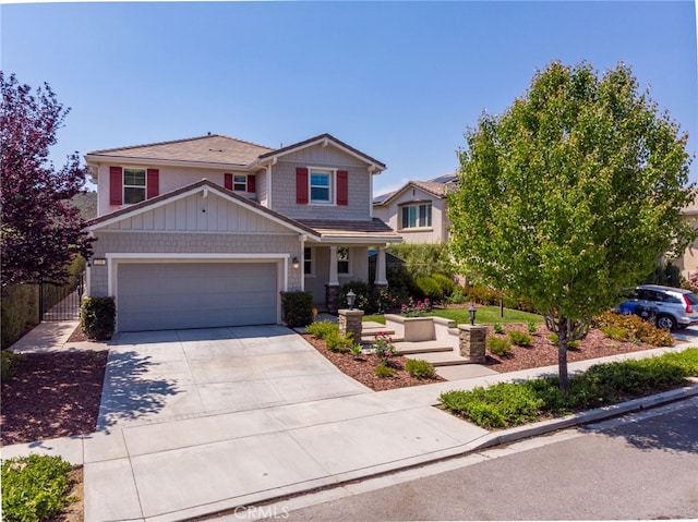craftsman house featuring an attached garage and concrete driveway
