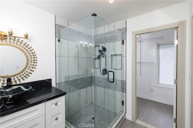 12246 Nadine Cir, Garden Grove, CA 92840 - full bath with vanity, baseboards, wood finished floors, and a stall shower