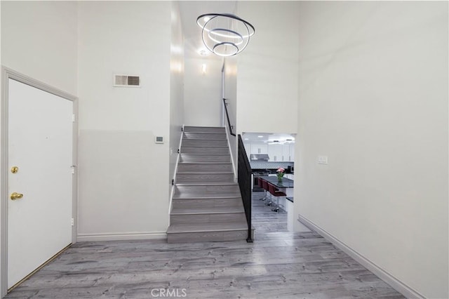 12246 Nadine Cir, Garden Grove, CA 92840 - stairs with visible vents, baseboards, and wood finished floors