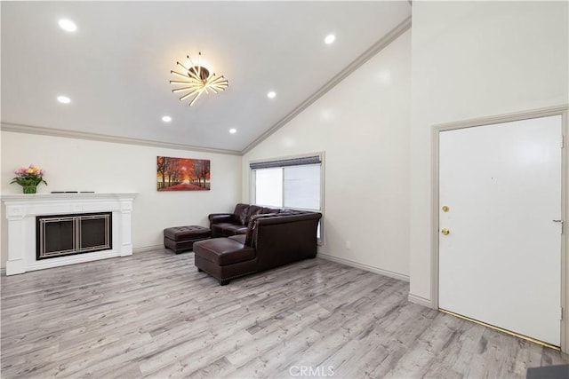 12246 Nadine Cir, Garden Grove, CA 92840 - living area with crown molding, baseboards, light wood-style floors, and a fireplace