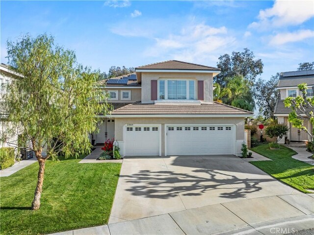 23664 Clearidge Dr, Valencia, CA 91354 - traditional-style home with stucco siding, an attached garage, concrete driveway, and a front lawn