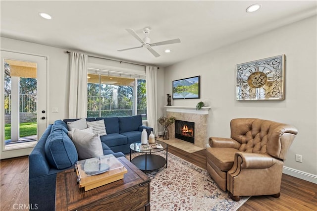 23664 Clearidge Dr, Valencia, CA 91354 - living room featuring wood finished floors, recessed lighting, a fireplace, and ceiling fan