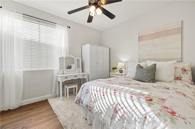 23664 Clearidge Dr, Valencia, CA 91354 - bedroom with light wood-style floors, baseboards, a ceiling fan, and a closet