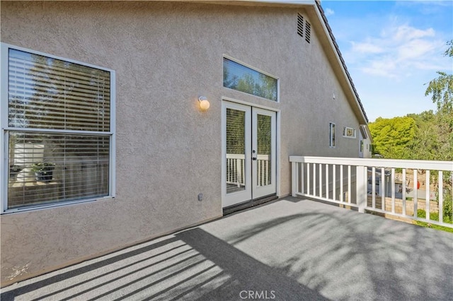 23664 Clearidge Dr, Valencia, CA 91354 - rear view of property with french doors and stucco siding