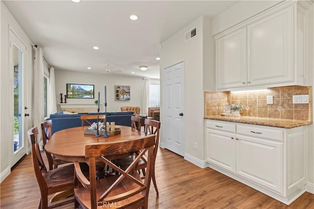 23664 Clearidge Dr, Valencia, CA 91354 - dining room with light wood-style floors, recessed lighting, and baseboards