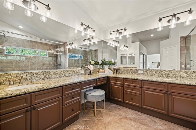 23664 Clearidge Dr, Valencia, CA 91354 - bathroom with vaulted ceiling, double vanity, a shower stall, and tile patterned floors