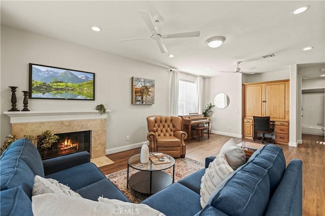 23664 Clearidge Dr, Valencia, CA 91354 - living area with ceiling fan, wood finished floors, recessed lighting, a high end fireplace, and a desk