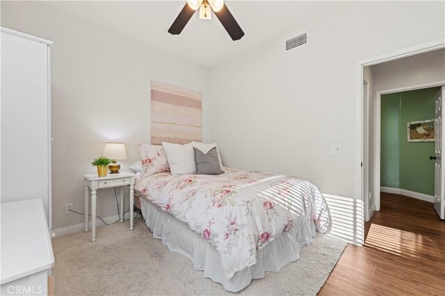 23664 Clearidge Dr, Valencia, CA 91354 - bedroom featuring baseboards, wood finished floors, and a ceiling fan