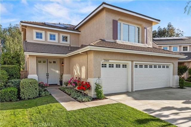 23664 Clearidge Dr, Valencia, CA 91354 - view of front of home with stucco siding, a garage, concrete driveway, roof mounted solar panels, and a tile roof
