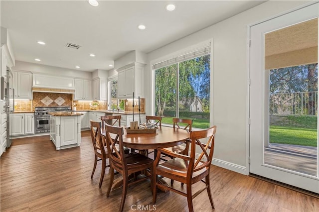 23664 Clearidge Dr, Valencia, CA 91354 - dining space featuring dark wood-type flooring, recessed lighting, and baseboards