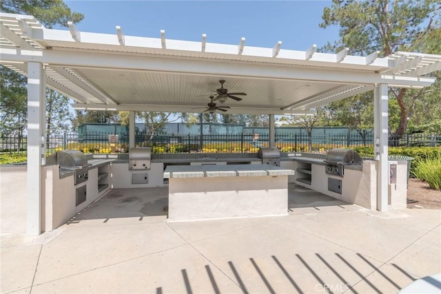 39312 Beringer Dr, Murrieta, CA 92563 - view of patio / terrace with exterior kitchen, grilling area, a pergola, and fence