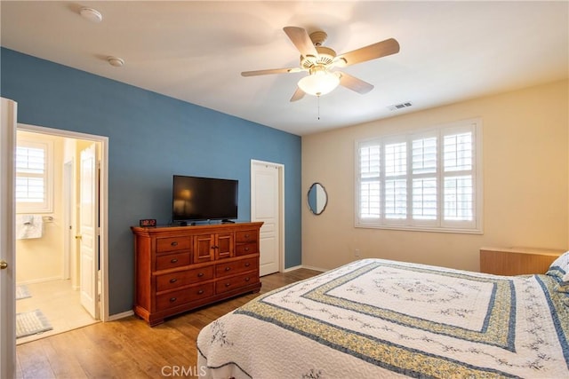 39312 Beringer Dr, Murrieta, CA 92563 - bedroom featuring wood finished floors, baseboards, ceiling fan, and ensuite bathroom