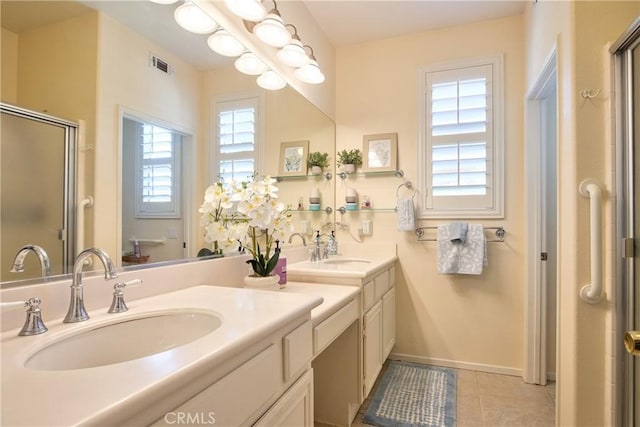 39312 Beringer Dr, Murrieta, CA 92563 - full bath featuring a stall shower, tile patterned flooring, double vanity, and baseboards