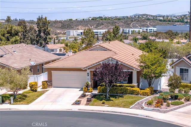 39312 Beringer Dr, Murrieta, CA 92563 - ranch-style home featuring a tile roof, concrete driveway, an attached garage, fence, and a residential view
