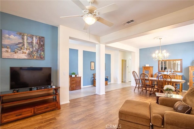 39312 Beringer Dr, Murrieta, CA 92563 - living area featuring a chandelier, light wood-style flooring, a ceiling fan, and baseboards