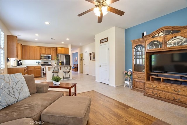 39312 Beringer Dr, Murrieta, CA 92563 - living room featuring ceiling fan, light tile patterned floors, recessed lighting, and baseboards