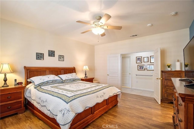 39312 Beringer Dr, Murrieta, CA 92563 - bedroom with light wood finished floors and ceiling fan