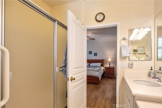 39312 Beringer Dr, Murrieta, CA 92563 - ensuite bathroom with wood finished floors, vanity, and a shower stall