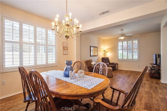 39312 Beringer Dr, Murrieta, CA 92563 - dining space featuring wood finished floors, baseboards, a chandelier, and a ceiling fan