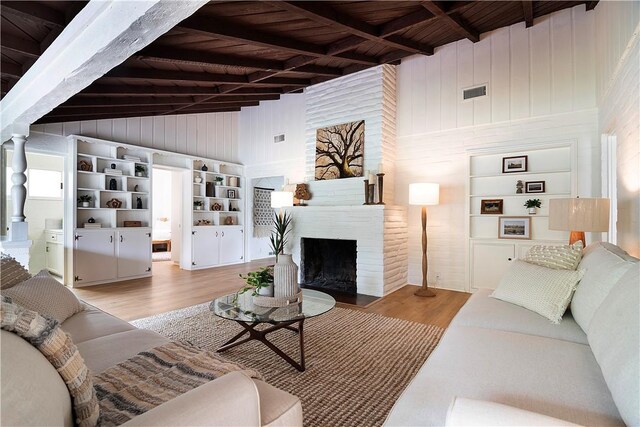 438 S Lamer St, Burbank, CA 91506 - living room with wooden ceiling with exposed beams, wood finished floors, wooden walls, high vaulted ceiling, and a large fireplace