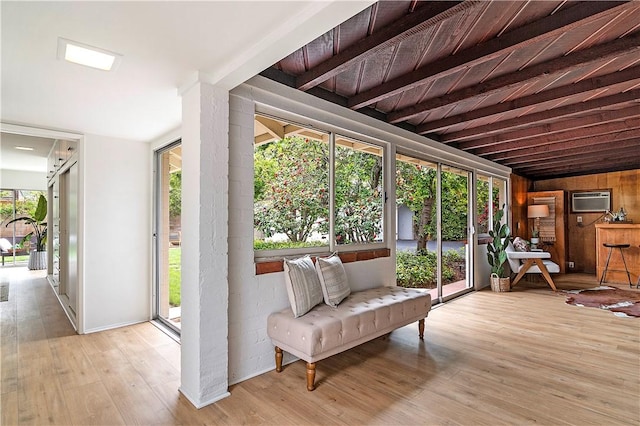 438 S Lamer St, Burbank, CA 91506 - sunroom / solarium with wood-type flooring, a wall unit AC, and beamed ceiling