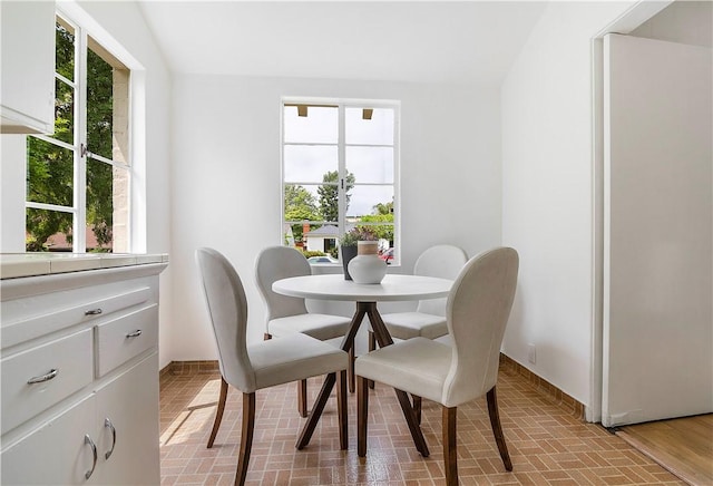 438 S Lamer St, Burbank, CA 91506 - dining room with baseboards, brick patterned floors, and plenty of natural light