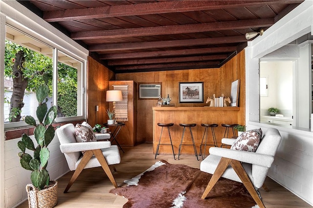 438 S Lamer St, Burbank, CA 91506 - sitting room with wood ceiling with exposed beams, a wall mounted air conditioner, wooden walls, and wood finished floors