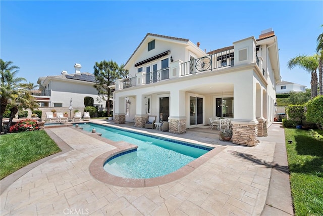 7 Rue Delacroix, Coto De Caza, CA 92679 - rear view of house featuring a balcony, a patio, stucco siding, and a bar