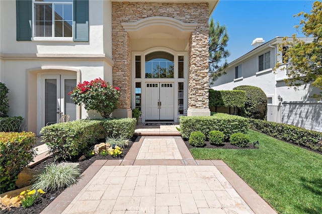 7 Rue Delacroix, Coto De Caza, CA 92679 - property entrance featuring stone siding, stucco siding, and fence