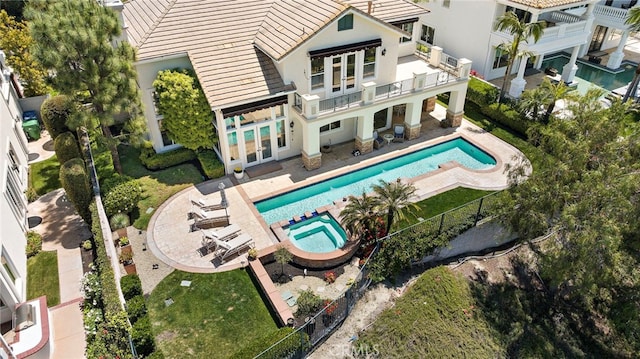 7 Rue Delacroix, Coto De Caza, CA 92679 - rear view of house with french doors, stucco siding, a balcony, a pool with connected hot tub, and a patio