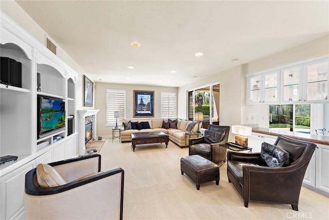 7 Rue Delacroix, Coto De Caza, CA 92679 - living room featuring light carpet, a glass covered fireplace, and recessed lighting