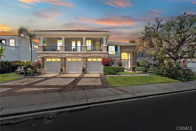 7 Rue Delacroix, Coto De Caza, CA 92679 - mediterranean / spanish house with a balcony, stucco siding, decorative driveway, an attached garage, and stone siding