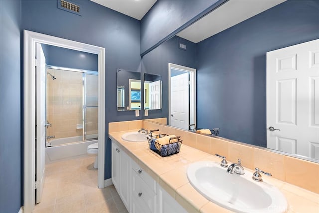 7 Rue Delacroix, Coto De Caza, CA 92679 - full bathroom featuring toilet, tile patterned floors, double vanity, and shower / bath combination with glass door