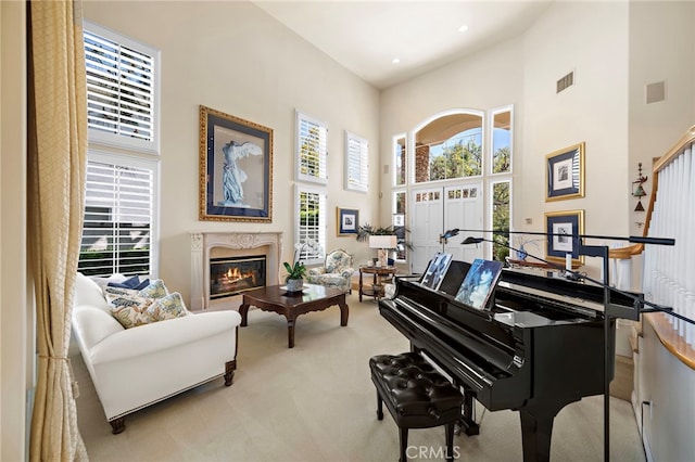 7 Rue Delacroix, Coto De Caza, CA 92679 - living area featuring a towering ceiling, light carpet, and a fireplace