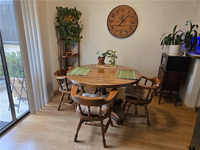 5805 Whitsett Ave Unit 102, Valley Village, CA 91607 - dining room featuring light wood-style flooring