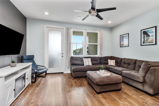 living area featuring a ceiling fan, recessed lighting, and light wood-type flooring