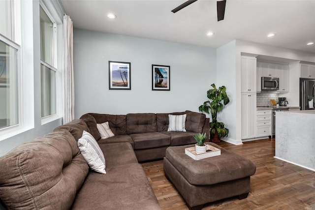 living room with recessed lighting, ceiling fan, and dark wood finished floors