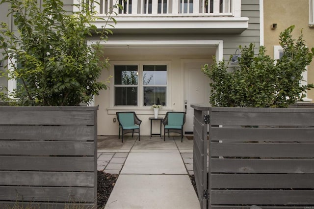 view of patio featuring a balcony