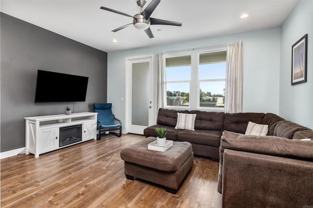 living area featuring recessed lighting, a ceiling fan, and wood finished floors