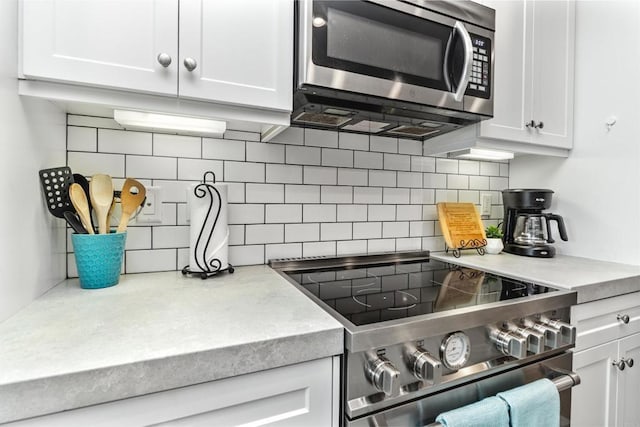 1121 Makena Way, Oceanside, CA 92054 - kitchen with backsplash, stainless steel appliances, white cabinets, and light countertops