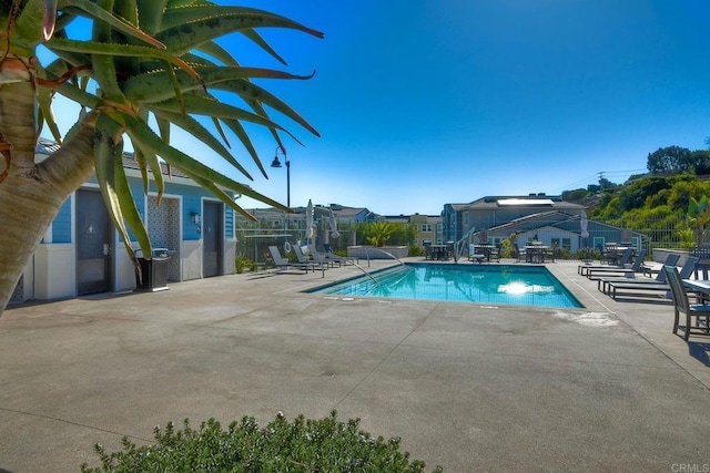 1121 Makena Way, Oceanside, CA 92054 - community pool with a patio area and fence