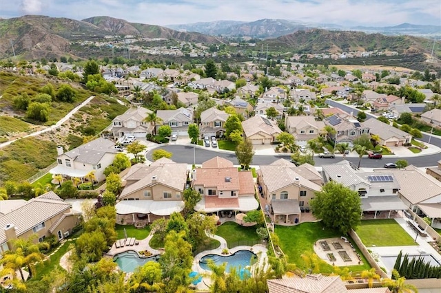 drone / aerial view with a residential view and a mountain view