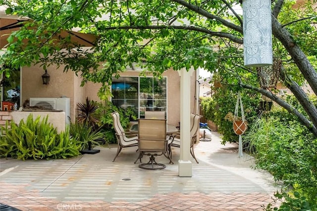 view of patio featuring outdoor dining area
