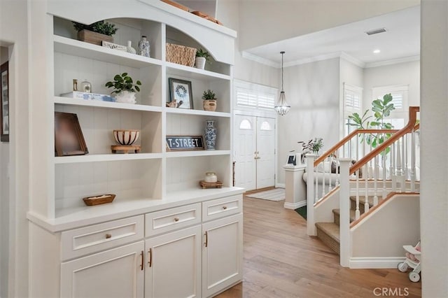 28433 Pinewood Ct, Saugus, CA 91390 - hall with crown molding, light wood-type flooring, plenty of natural light, stairway, and recessed lighting