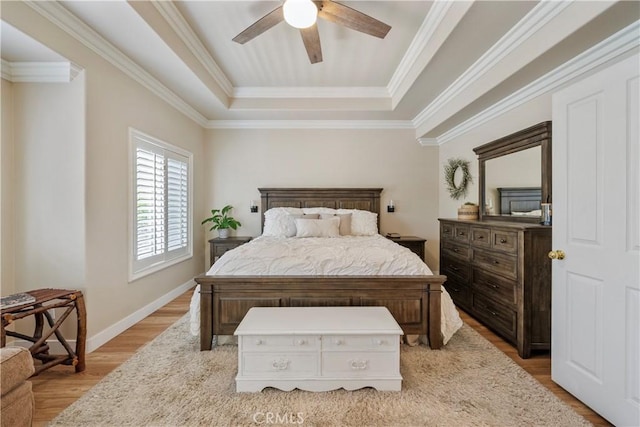 28433 Pinewood Ct, Saugus, CA 91390 - bedroom featuring a tray ceiling, light wood finished floors, a ceiling fan, and ornamental molding