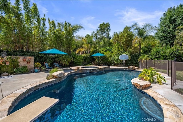 28433 Pinewood Ct, Saugus, CA 91390 - view of pool featuring a pool with connected hot tub, a diving board, a patio area, and view of scattered trees